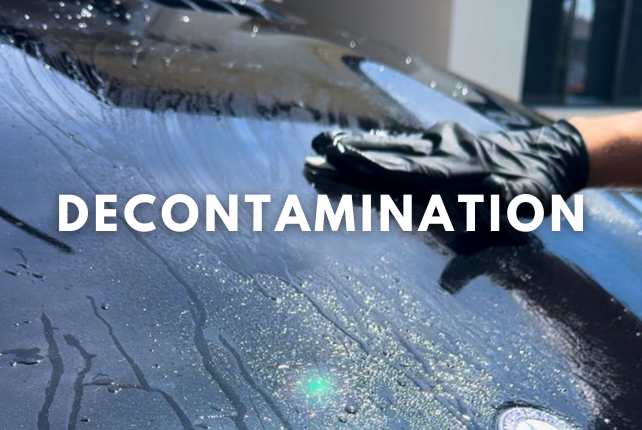 Decontamination process using a clay bar to remove embedded contaminants from a car's surface.