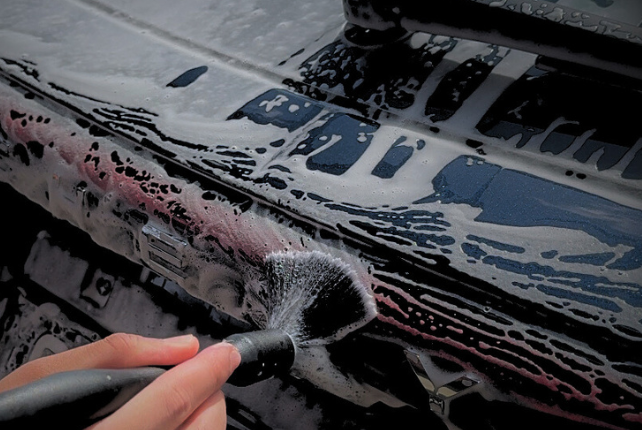 Soft bristle brush used during a decontamination wash, thoroughly cleaning hard-to-reach areas for a spotless finish.